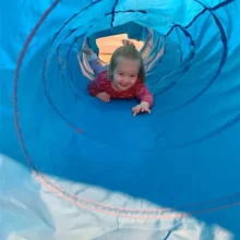 Child in a play tube