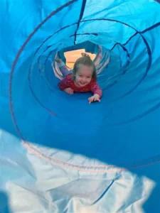 Child in a play tube