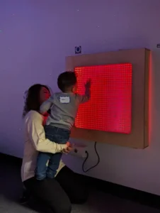 Mom and child looking at a light box