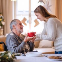Elderly man with his caregiver