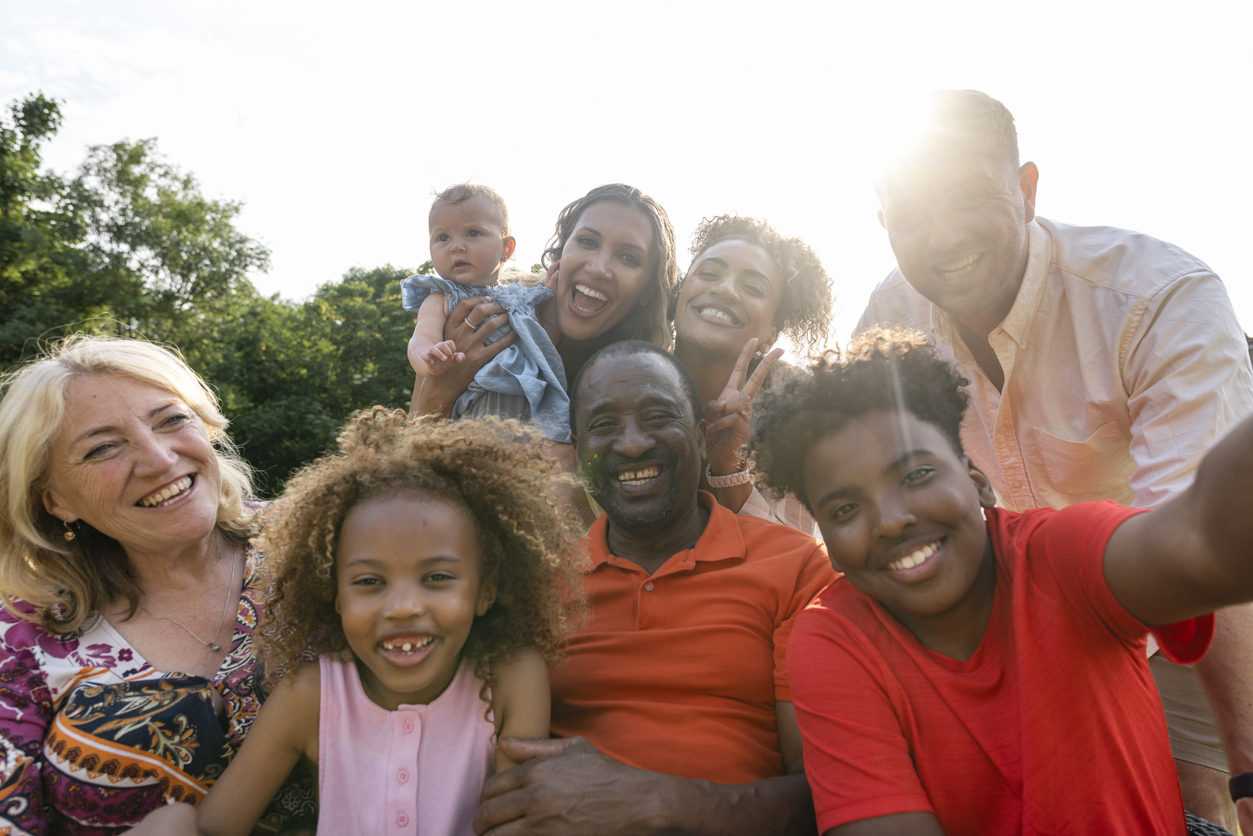 Portrait of multi-generation family smiling on a summer day