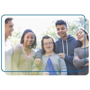 A diverse group of teenage friends stand together, laughing and smiling