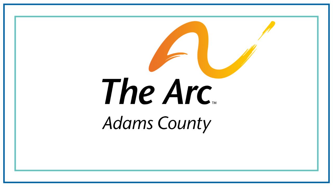 Logo for The Arc Adams County featuring an orange and yellow brushstroke arc above the words “The Arc” in black text, with “Adams County” written below. The design appears on a light gray background with a teal and dark blue double-line border.